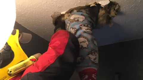 West Midlands Fire Service The woman's leg was stuck