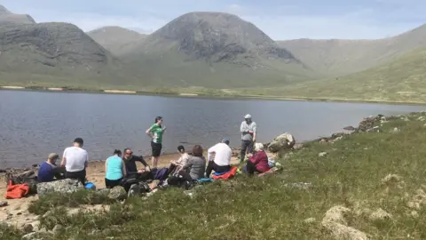 Family by the water at Loch Dochard