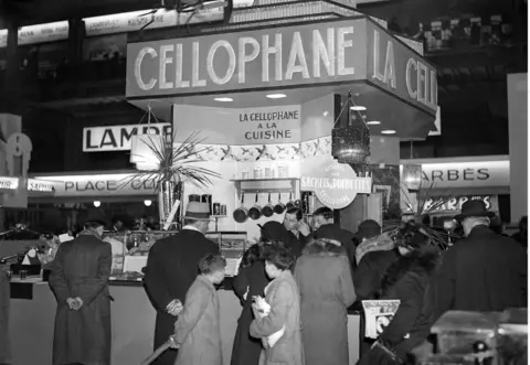 Getty Images A Cellophane display at a French home economics show in the 1920s