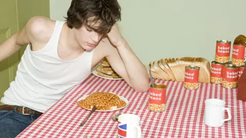 Getty Images Student and baked beans