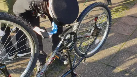 Devon & Cornwall Police Officer marking a bike