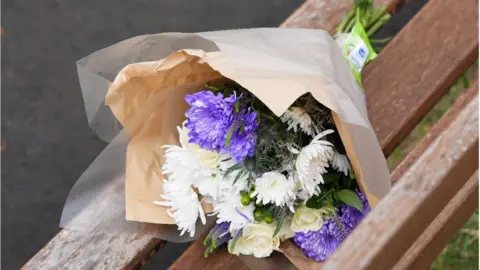 PA Media flowers left near to the scene in Plaistow, east London
