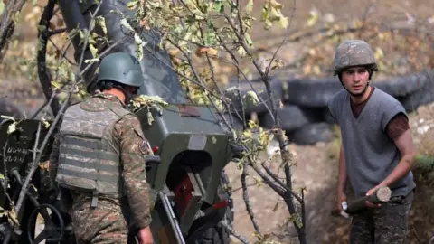 EPA A picture provided by the Armenian Defence Ministry Press Office via PAN Photo shows Armenian soldiers fire during military combat with the Azerbaijani army in the Nagorno-Karabakh Republic