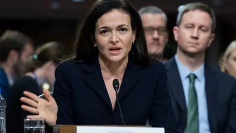 Getty Images Facebook's Sheryl Sandberg is questioned by US politicians