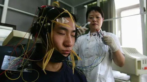 Getty Images A young Chinese internet addict receives an electroencephalogram check at the Beijing Military Region Central Hospital 6 July 2005 in Beijing, China.