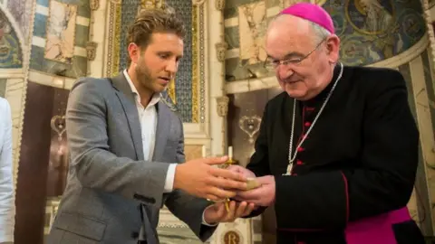 Catholic Church England and Wales James Rubin presented the relic to Archbishop George Stack