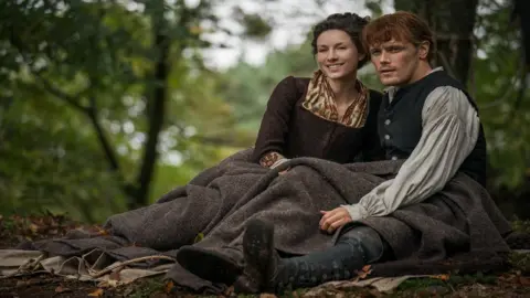 Aimee Spinks In the fourth season, Jamie (Sam Heughan) and Claire (Caitriona Balfe) are shipwrecked in North Carolina