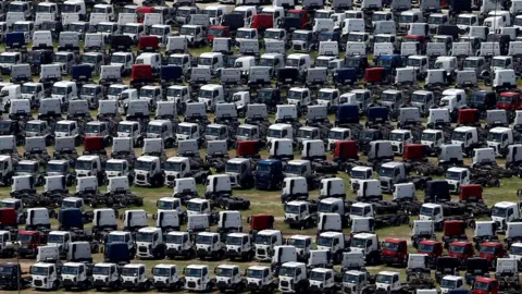 New Ford trucks are seen at a parking lot of the Ford factory in Sao Bernardo do Campo, Brazil, February 12, 2015.