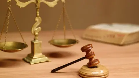 Getty Images Scales of justice and a gavel