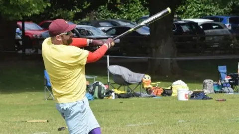Belfast Northstars David Gray swinging a baseball bat