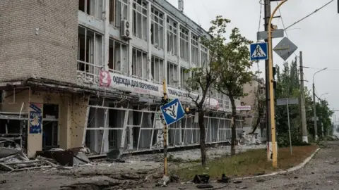 AFP via Getty Images A building destroyed by shelling in Severodonetsk on 18 May