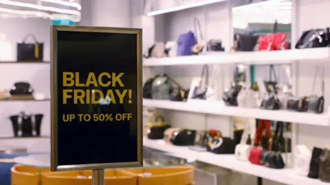 Reuters Sign reading "Black Friday! Up to 50% off"