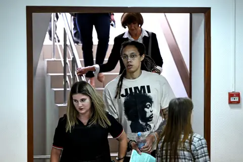Kirill Kudryavtsev / AFP American basketball star Brittney Griner (centre) arrives at a hearing at a court in Khimki, near Moscow, on 1 July 2022