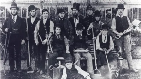 Cambridge University Botanic Garden 1876 picture shows curator William Mud in a top hat with horticultural staff, Cambridge University Botanic Garden