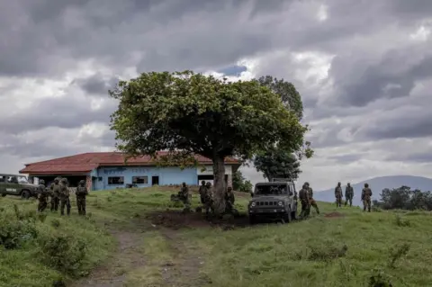 AFP East African Regional Force (EACRF) soldiers guard after the meeting between EACRF officials and M23 rebels during the handover ceremony at Rumangabo camp in eastern Democratic Republic of Congo - Friday 6 January 2023