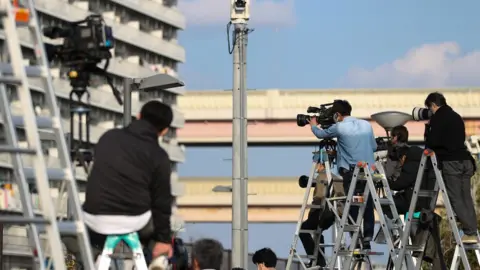 Getty Images Members of the press gather outside the Tokyo Detention House on March 05, 2019 in Tokyo, Japan.