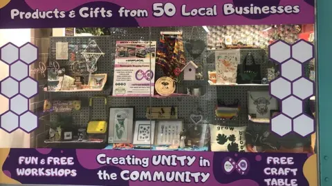 John Devine/BBC The front of the Unity shop in Peterborough