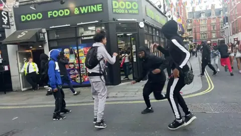 Youths storm corner shop