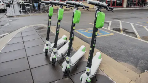 Getty Images Lime scooters on a street