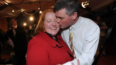 Pacemaker Naomi Long celebrated with her husband Michael after she became MP for East Belfast in 2010