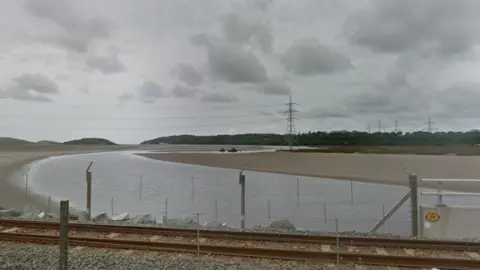 Google Pylon on the Dwyryd estuary with the rail line in the foreground