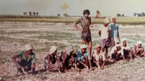 Gurdip Sigh Bassi Nav's dad Gurdip on the family's fields in 1979