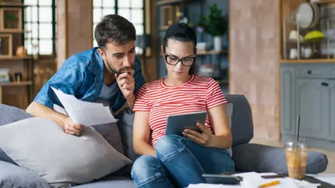 Getty Images Couple looking at computer screen