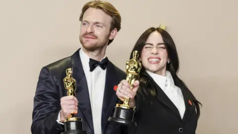 EPA Finneas O'Connell (L) and Billie Eilish, winners of the Oscar for Best Original Song for 'What Was I Made For?' from 'Barbie,' hold up their Oscars in the press room during the 96th annual Academy Awards ceremony at the Dolby Theatre in the Hollywood neighborhood of Los Angeles, California, USA, 10 March 2024