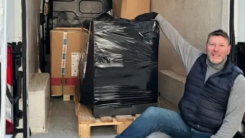 Marc Laine Nick Jenkins with donated items