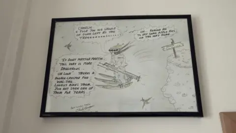 Gareth Lloyd/BBC Artwork by Bronson on Mr Oldham's wall