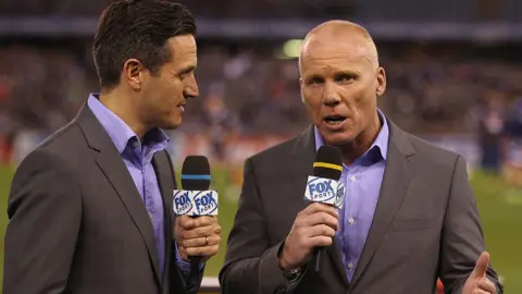 Getty Images Robbie Slater in his role as a football commentator on television