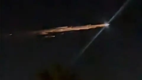 Shower of lights streaks across southern California sky.