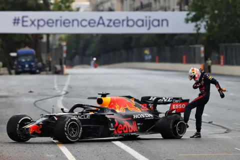 Clive Rose/Getty Images Max Verstappen kicks the tyre of his Red Bull car