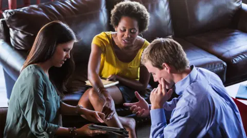 Getty Images Young people in discussion