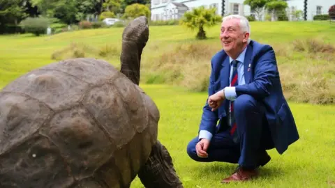 PA Media Sir Lindsay Hoyle and giant tortoise