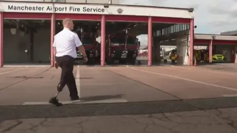 Firefighter Matt Bourner walking at fire station