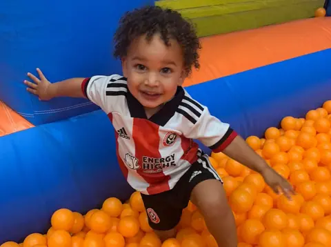 Dacres family Picture of Addy indoors in a play area