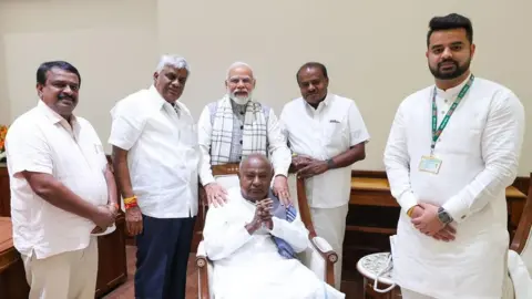 HD Deve Gowda's X account Mr Revanna (right) seen meeting PM Modi with former prime minister, HD Deve Gowda, and party chief HD Kumaraswamy
