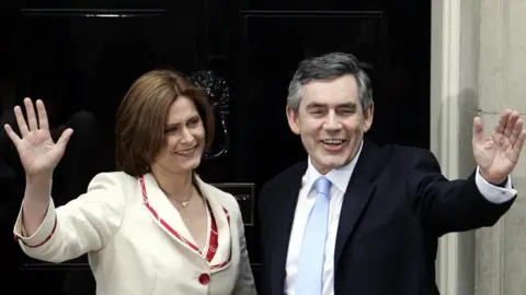 PA Media Gordon Brown and wife Sarah outside No 10 as he took office in June 2007