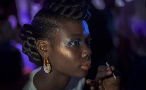 Marta Moreiras A model has her make-up done backstage during Dakar Fashion Week in Dakar, Senegal