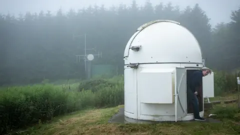 Jay Tate exiting on of the smaller telescopes at the centre