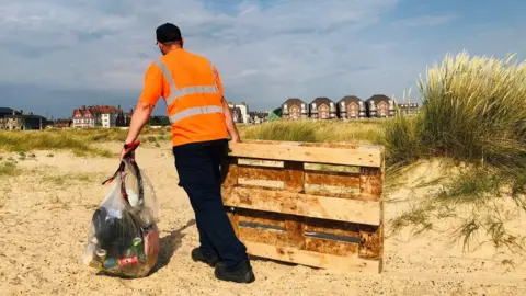 BBC A litter picker on Great Yarmouth beach