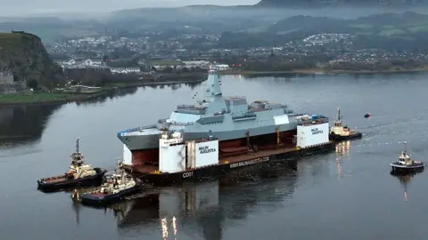 HMS Glasgow was transported from Govan to Loch Long where it was floated for the first time.