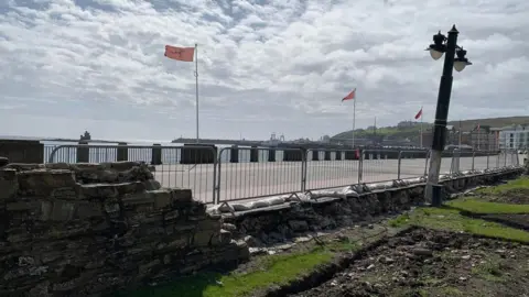 BBC Damaged walls at sunken gardens on Douglas promenade