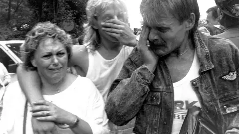 Getty Images East Germans cross the Hungarian border into Austria - 21 August 1989