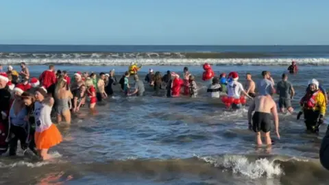 Dippers in the sea at Seaton Carew, Hartlepool