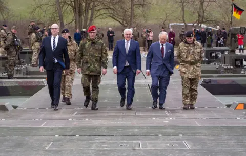 PA Media King Charles III (2nd from right) and German President Frank-Walter Steinmeier (3rd from right) during a visit to meet representatives from the German and British Amphibious Engineer Battalion unit at Finowfurt, Schorfheide, north of Berlin