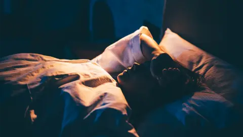 Getty Images Person in bed