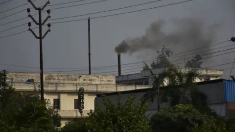 Getty Images Smoke rising out of a factory on October 10, 2017 in Ghaziabad, India.