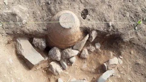 ROUND MOUNDS ISLE OF MAN Unturned urn containing cremated remains